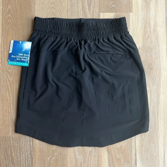 NWT Coolibar Pisa Skort in black. Longer length. Stretch. UPF 50 